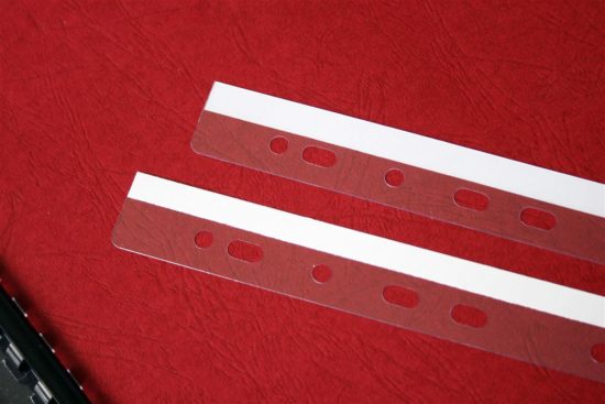 Self-adhesive spines for files
